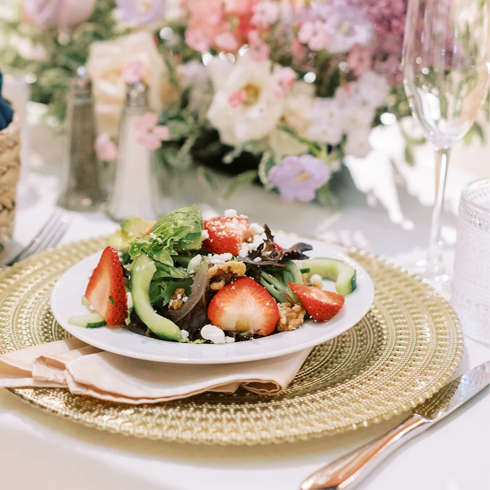 Strawberry salad with flowers on the table