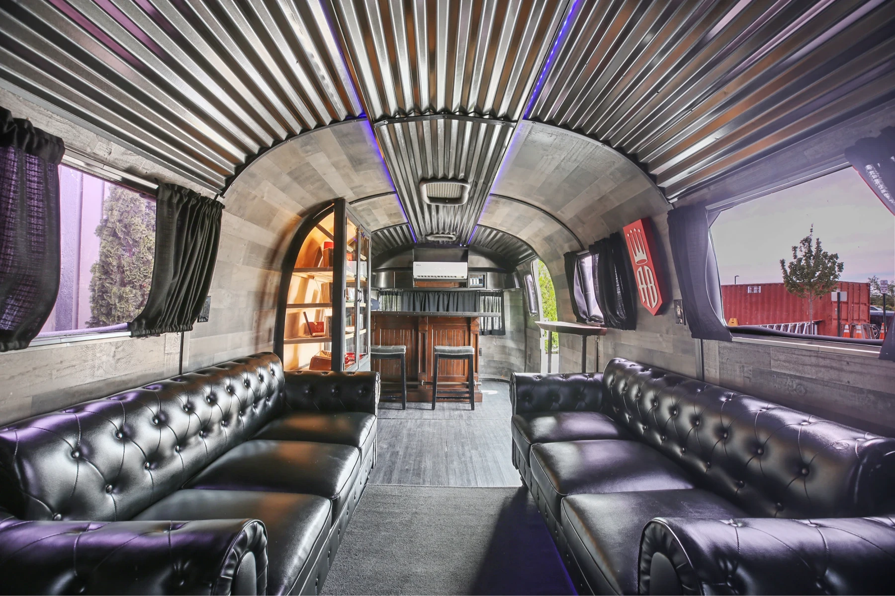 Inside the plush Air Stream cigar lounge with leather couches and full bar