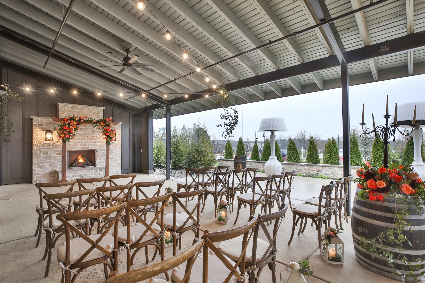 A wedding ceremony venue outdoors with large fireplace and a lovely view
