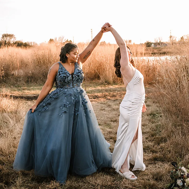 The scenic views surrounding Brenstville Hall, including tall grasses and trees, used as a photo op for the bridal party