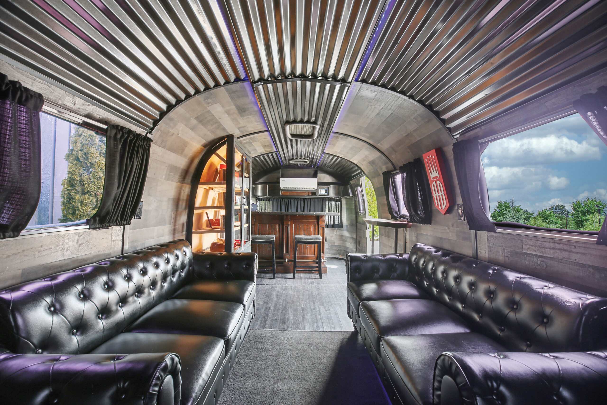 The Airstream cigar lounge is the perfect place for the groom to relax before their wedding.